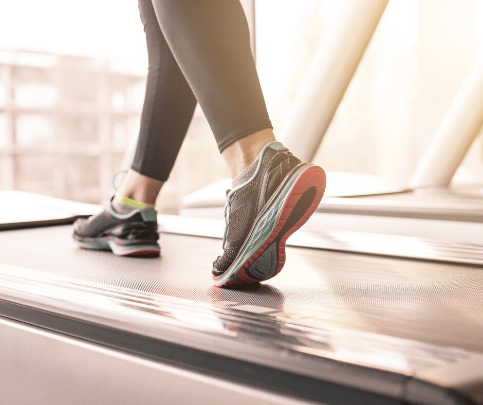 Untitled design (1) person walking on treadmill to help with back pain